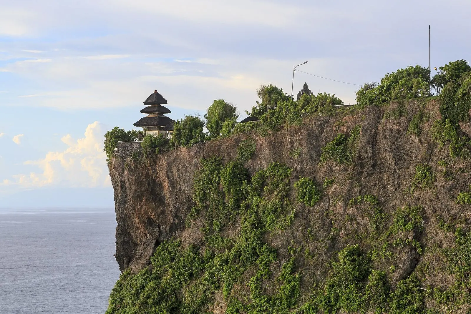 Uluwatu temple on the edge of a cliff above the Indian Ocean